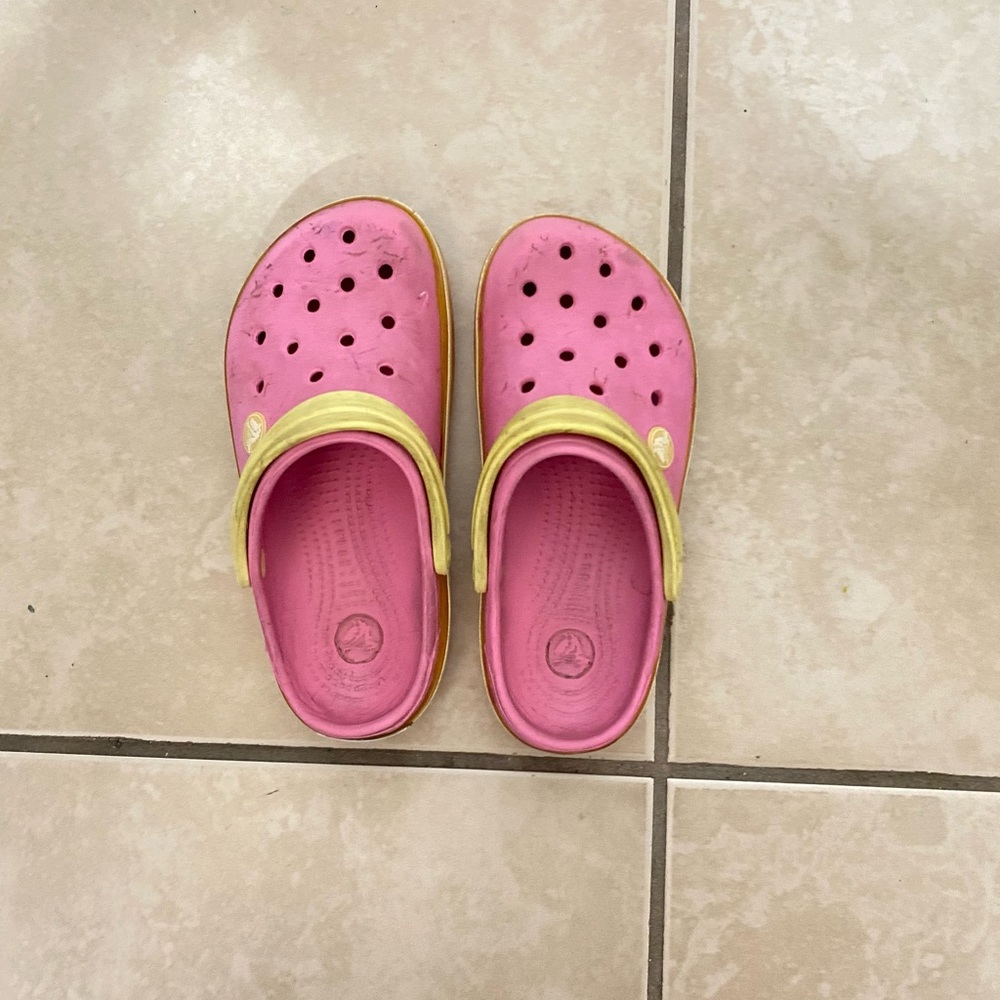 Pink and yellow crocs